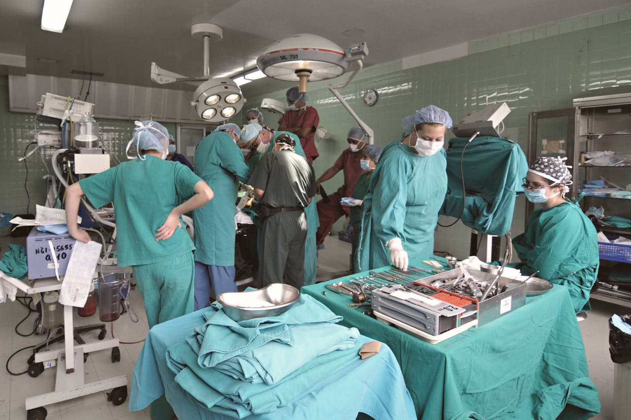 gallery-4 A surgical team performs an operation in a hospital operating room.