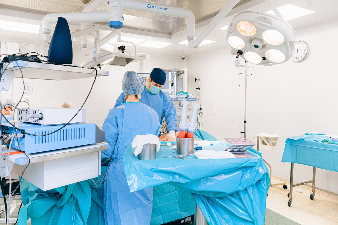 services-03 Surgeons in an operating room performing medical procedures with precision and care.